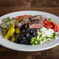 Dr. Greek Salad · Crisp romaine, tomatoes, roasted red peppers, feta, pepperoncini, black olives, cucumbers, r...