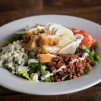 Dr. Rosen Rosen Salad · Crisp romaine, bleu cheese crumbles, bacon, sliced egg, tomatoes, cucumbers and ranch dressi...