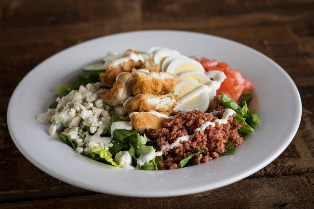 Dr. Rosen Rosen Salad · Crisp romaine, bleu cheese crumbles, bacon, sliced egg, tomatoes, cucumbers and ranch dressing. Low carb.