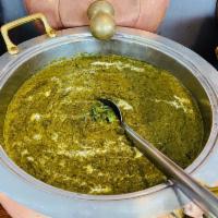 Saag Paneer · Spinach and homemade farmer’s cheese sauteed in herbs and spices.
