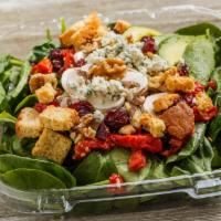 Walnut Spinach Salad · Baby spinach, walnut pieces, crumbled bleu cheese, avocado, sun-dried tomatoes, mushrooms, d...