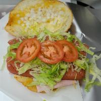 Torta de Jamon · Toasted bolillo with mayonnaise, ham, queso fresco, lettuce, tomato, onion, avocado, and pic...