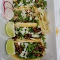 Taco · Corn tortilla filled with your choice of meat, topped with fresh cilantro, fine diced onions...