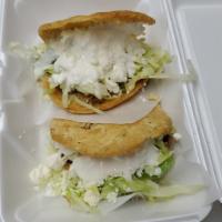 Gorditas de Picadillo · Lightly fried homemade gordita filled with ground beef picadillo, shredded lettuce, crumbled...