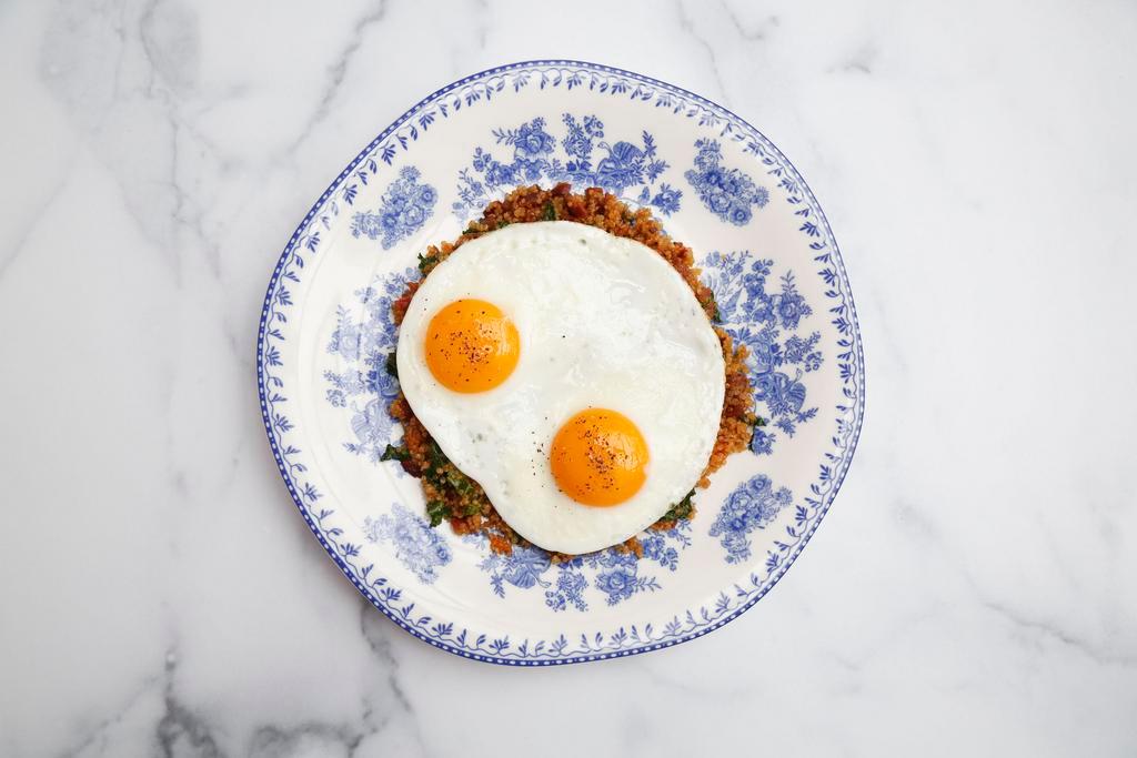Quinoa Fried Rice Brunch · Sauteed quinoa, kale and bacon served with 2 organic fried eggs.