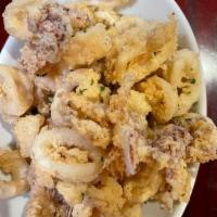 Fried Calamari · Fried calamari in a light butter sauce with a special marinara sauce on the side.