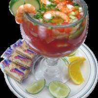 Shrimp Cocktail · Steamed shrimp in a sweet Mexican cocktail sauce garnished with avocado, cilantro, onions an...