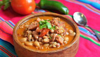 Charros Beans · Pintos and franks. Full of slow cooked flavor, our house pinto beans are flavored with ham, ...