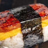 Breakfast Musubi · Caramelized sweet soy glaze spam, tamago egg, and sushi rice with nori wrap.