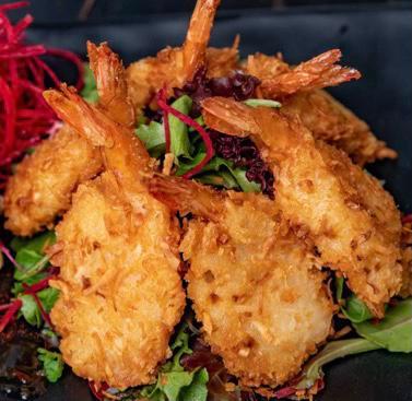 Coconut Shrimp · 6 pieces. Fried jumbo shrimp breaded with coconut and sweet chili sauce.
