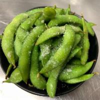 Truffle Edamame · Vegetarian & gluten-free. Steamed edamame in a white truffle butter topped with sea salt.