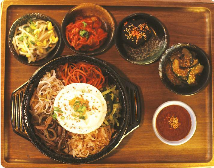Bibim Bap · Sauteed and seasoned vegetables mix with rice served with a fried egg on top and house spicy sauce.
