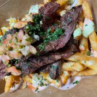 Skirt Steak Box / Churrasco · Grill skirt steak with pico de gallo, melted cheese, avocado sauce, chimichurri sauce.