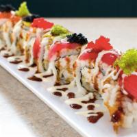 Butterfly Roll · Crab meat, avocado and shrimp tempura topped with shrimp, salmon, tuna and avocado.