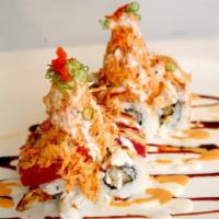 Mountain Roll · Shrimp tempura topped with tuna, salmon, albacore tuna and spicy crab.