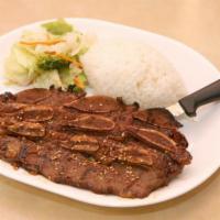 Teriyaki Beef Short Ribs · Korean style beef short ribs marinated and served grilled. Served with steamed rice and stir...