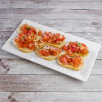 Bruschetta · Diced tomatoes, basil, olive oil, and Parmesan cheese over garlic toast.