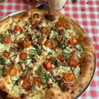 Chicken Club Pizza · Garlic cream sauce, roasted chicken, bacon, cherry tomatoes, basil, mozzarella