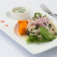 Ceviche Clasico · Peruvian signature dish. White fresh mahi-mahi fish marinated in lime juice mixed with aj? l...