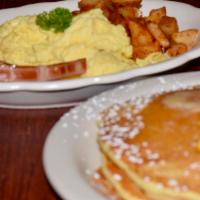 Undecided Pancakes · 2 pancakes, 2 eggs, homefries and your choice of meat.