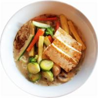 Spicy Vegan · Vegetable and spicy red beans broth, tofu, sauteed vegetables, Brussels sprouts and black ga...