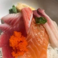 Chirashi · A variety of seafood (Chef's Choice) over seasoned rice served with inari sushi 