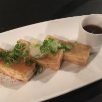 Agedashi Tofu · Tempura dipped tofu served in a a sweet sake sauce topped with ginger.