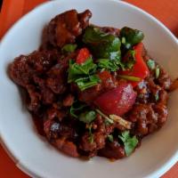 Chicken Chilli · Fried boneless chicken sautéed with onion, garlic, tomatoes, green chilli, mixed peppers and...