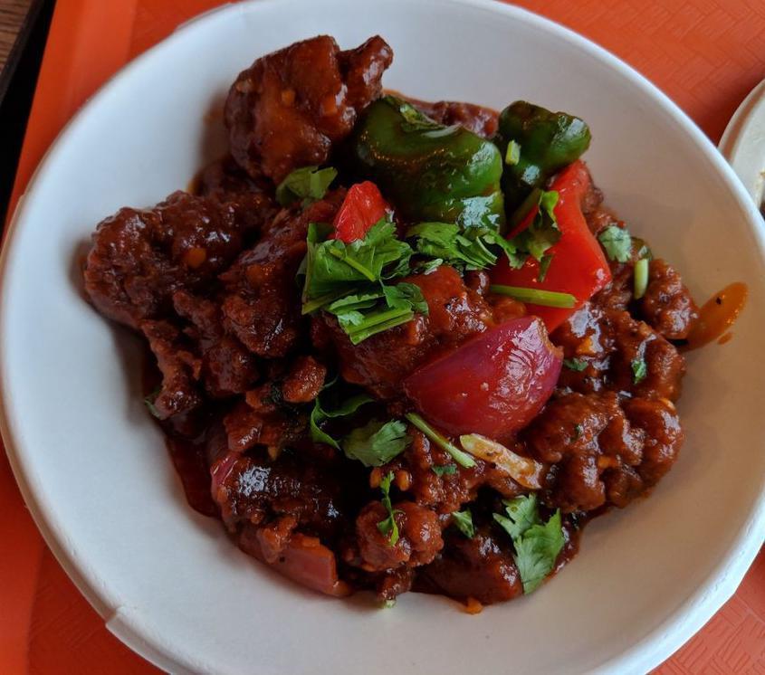 Chicken Chilli · Fried boneless chicken sautéed with onion, garlic, tomatoes, green chilli, mixed peppers and special chilli sauce.