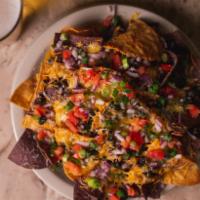 Nachos · tortilla chips, black beans, jack and cheddar cheeses, red onions, tomatoes and scallions se...