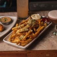 Garlic Fries · French fries tossed with Fresh minced garlic, parmesan cheese and parsley, served with garli...