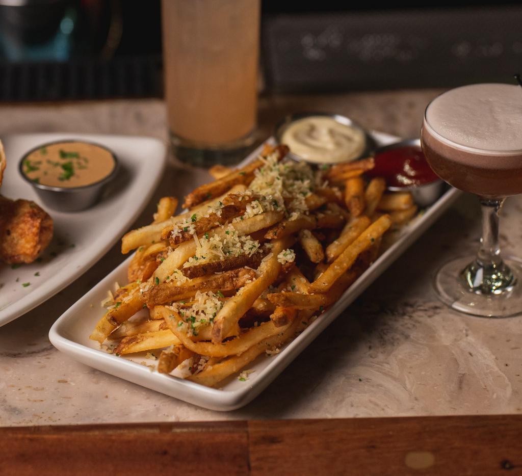 Garlic Fries · French fries tossed with Fresh minced garlic, parmesan cheese and parsley, served with garlic aioli.