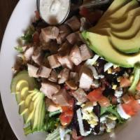 Smoked Chicken Cobb · Mixed greens topped with house smoked chicken, bacon, hard-boiled egg, blue cheese crumbles,...