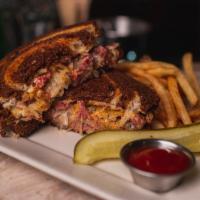 Paddy’s Reuben Sandwich · Grilled Marble Rye, Your choice of beer braised corned beef brisket or grilled turkey, sauer...