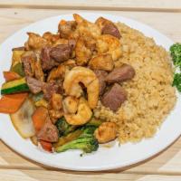 House Special Fried Rice · Includes chicken, steak, and shrimp. Served with grilled vegetable. 