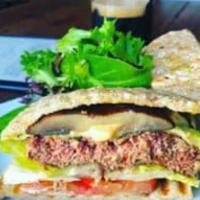 Culture Impossible Burger · Plant based burger, vegan mozzarella cheese, roasted portobello mushrooms, caramelized onion...