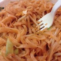 N25. Pad Thai · Famous Thai stir fried rice noodles with eggs, scallion, bean sprouts and peanuts in tamarin...