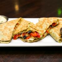 Southwest Quesadilla · Chihuahua cheese, roasted corn, black beans, fire roasted red peppers, avocado crema and sal...