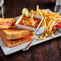 Grown-Up Grilled Cheese Sandwich · Thick-cut bacon, tomato, white cheese spread, cheddar, provolone on Texas toast and cup of s...