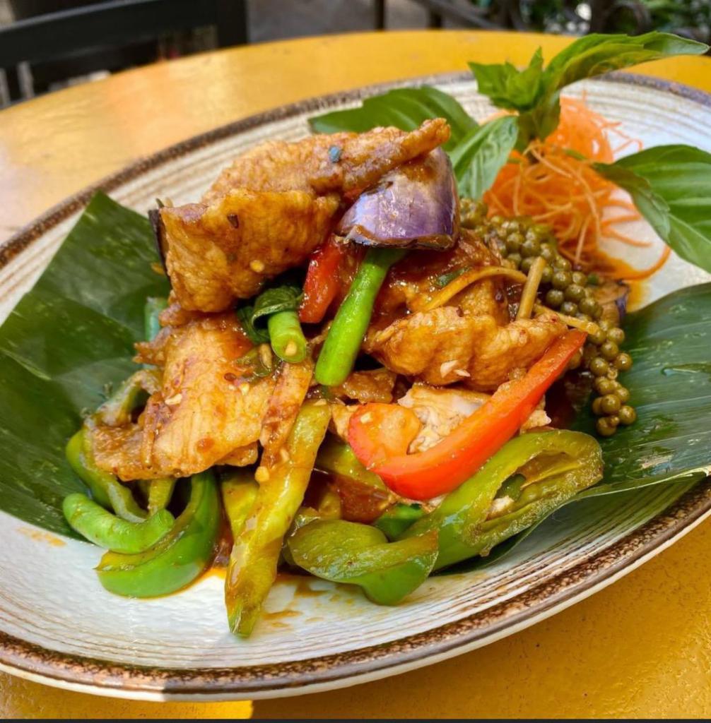 Spicy Catfish  · *** Spicy. Deep-fried then sauteed fillets of wild catfish with Thai eggplant, bell peppers, green pepper corn, kachai root, basil, and our very own spicy sauce. Served with steamed jasmine rice.
