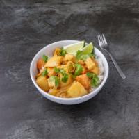 E11. Massaman Curry · Sweet Thai curry with potatoes, carrots, onions and peanuts
in coconut milk. Served with jas...