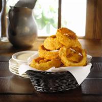 Salt and Pepper Onion Rings · Hand-breaded onion rings.