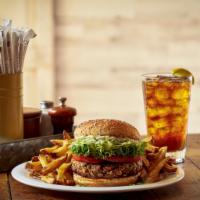House-Made Vegan Veggie Burger · Blend of vegetables, oats, garbanzo beans and mushrooms, served on a cracked wheat bun with ...