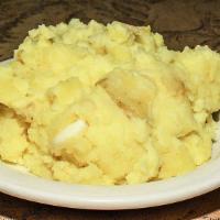 Garlic Mashed Potatoes · Garlic mashed potatoes with gravy.