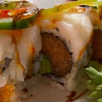 13. Jun Roll · spicy salmon,avocado inside topped with white tuna,jalapeno and chili sauce