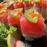 25. Pink Lady Roll · spicy crabmeat,avocado,crunch inside, top with tuna,jalapeño and spicy sauce