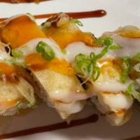 24. Eagles Roll  · Spicy crab meat, avocado, cream cheese inside, tempura style with special sauce on top.