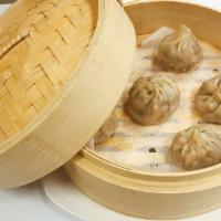 D6. Shanghai Dumplings · 6 pieces. Veg Dumpling filled with vegetarian meat. Vegan
