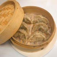 D7. Steamed Vegetable Dumplings · 6 pieces. Chinese cabbage, shiitake mushrooms, celery and dried tofu. Vegan.