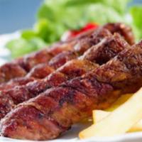 22. Seekh Kabob · Ground lamb seasoned with herbs and spices grilled on skewers.
